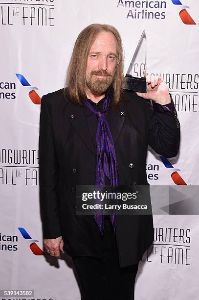 Tom Petty poses with award during Songwriters Hall Of Fame 47th Annual Induction And Awards at Marriott Marquis Hotel on June 9, 2016 in New York...