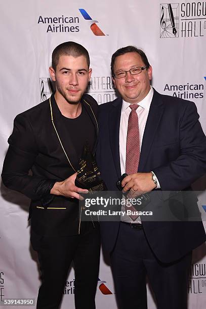 Nick Jonas and Paul Jonas attend Songwriters Hall Of Fame 47th Annual Induction And Awards at Marriott Marquis Hotel on June 9, 2016 in New York City.