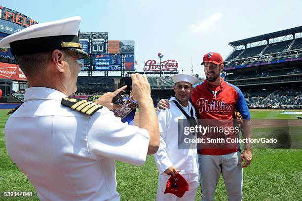 Sailor poses with Philadelphia Phillies pitcher, Cliff Lee before the 5th Annual Military Appreciation game at Citi Field during Fleet Week New York,...