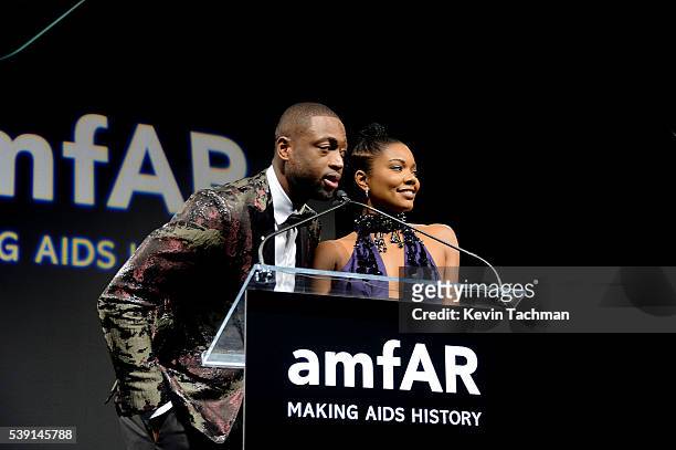 Dwyane Wade and Gabrielle Union speaks on stage during the 7th Annual amfAR Inspiration Gala at Skylight at Moynihan Station on June 9, 2016 in New...