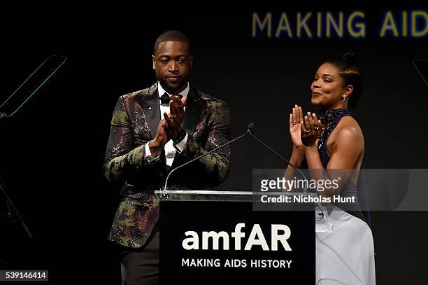 Dwyane Wade and Gabrielle Union speak onstage during the 7th Annual amfAR Inspiration Gala at Skylight at Moynihan Station on June 9, 2016 in New...