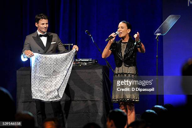 Model Alex Lundqvist and Andrea Fiuczynski speak onstage during the 7th Annual amfAR Inspiration Gala at Skylight at Moynihan Station on June 9, 2016...