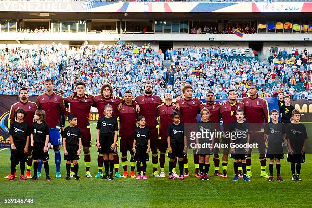 Players of Venezuela line up during the Venezuela National Anthem before a group C match between Uruguay and Venezuela at Lincoln Financial Field as...
