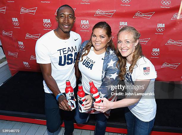 Olympians Perry Baker, Amanda Bingson and Becky Sauerbrunn attend A Toast To Team Budweiser mural unveiling at Bar Local on June 9, 2016 in New York...