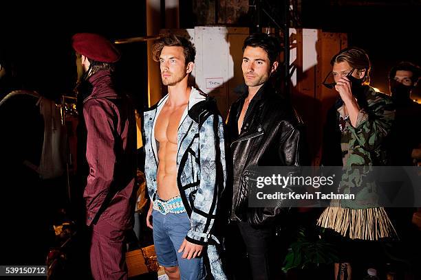 Models prepare backstage before the fashion show at the 7th Annual amfAR Inspiration Gala at Skylight at Moynihan Station on June 9, 2016 in New York...