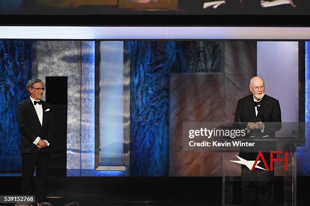 Honoree John Williams accepts the AFI Life Achievement Award from director Steven Spielberg onstage during American Film Institutes 44th Life...