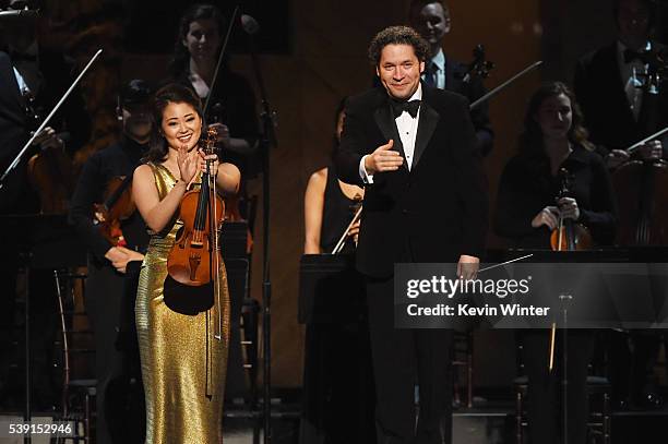 Violinist Simone Porter and conductor Gustavo Dudamel perform onstage during American Film Institutes 44th Life Achievement Award Gala Tribute to...