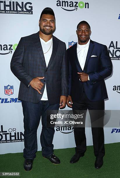 Professional National Football League players Mike Iupati and David Johnson of the Arizona Cardinals attend the premiere of Amazon Video's 'All Or...