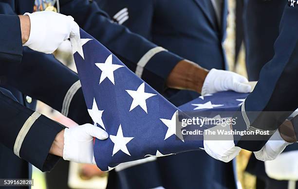 The Air Force casket team folds the flag during the Military funeral service for 2LT Malvin Greston "Marvelous Mal" Whitfield , a Tuskegee Airmen and...