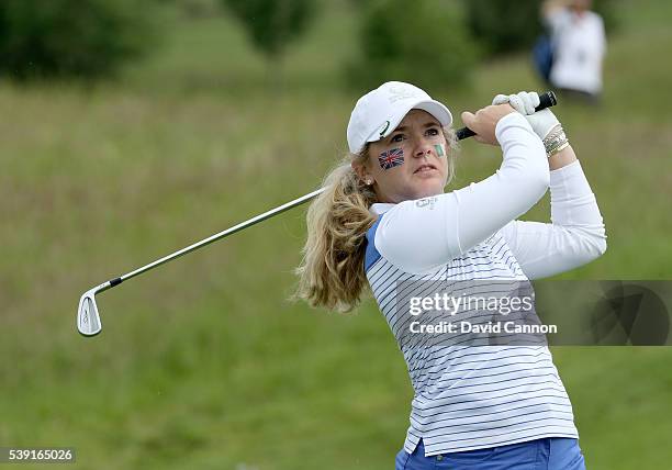 Bronte Law of England and the Great Britain and Ireland team plays her tee shot on the fourth hole during the morning foursomes matches of the 2016...