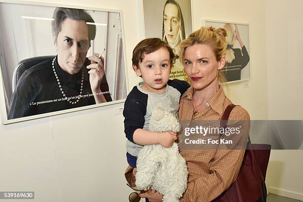 Elise Kleeb and son Loup attend "55 Politiques" : Exhibition Preview at Galerie Dupin on June 9, 2016 in Paris, France.