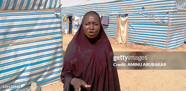 Displaced person Aisha Bala speaks outside her tent about lack of adequate food in the Dalori Internally Displaced People's Camp for people displaced...