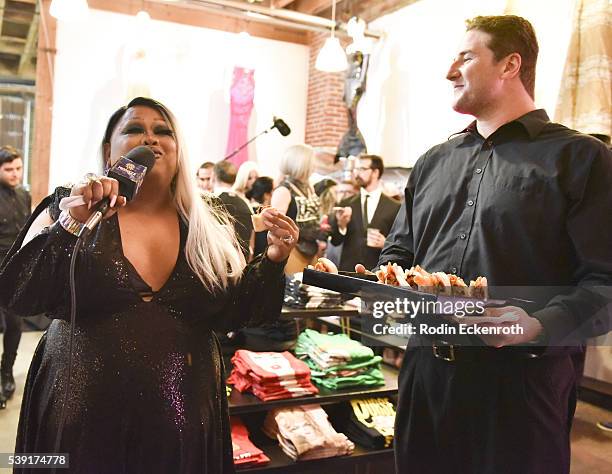 Jiggly Caliente tries the appetizers during the opening of PEG: The Store + PEG Records Artist Showcase at Arts District Co-op on June 9, 2016 in Los...