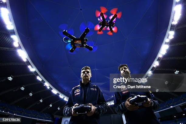 Daniel Ricciardo of Australia and Red Bull Racing and Max Verstappen of Netherlands and Red Bull Racing race drones during previews to the Canadian...