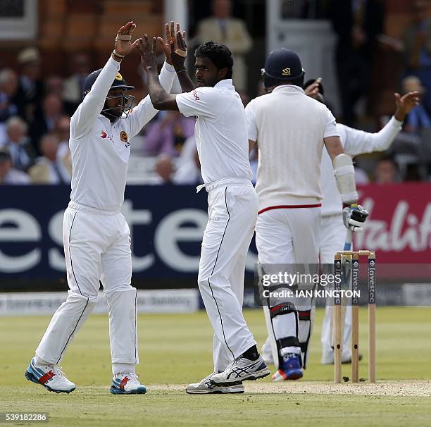 Sri Lanka's Shaminda Eranga celebrates taking the wicket of England's James Anderson for 4 runs during play on the second day of the third Test...