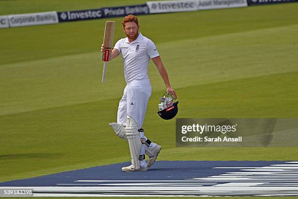 England's Jonny Bairstow raises his bat as he walks from the pitch at the end of the England innings undefeated on 167 during day two of the 3rd...