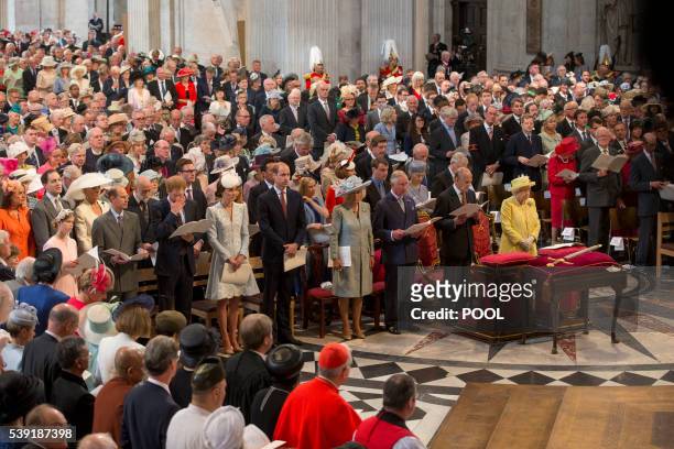 Britain's Britain's Queen Elizabeth II and other members of the royal family and the congregation stand during a national service of thanksgiving for...