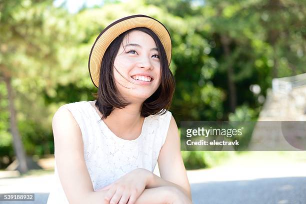 sunny day - japanese woman looking up stock pictures, royalty-free photos & images
