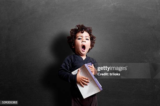 schoolgirl yawning in classroom during study - boy yawn stock pictures, royalty-free photos & images