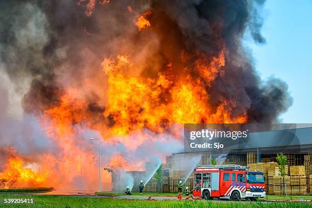 fire fighters at an industrial inferno - incineration plant stock pictures, royalty-free photos & images