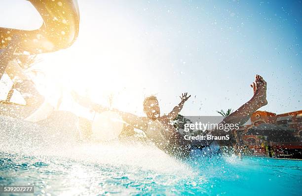 man having fun on water slide. - waterpark stockfoto's en -beelden