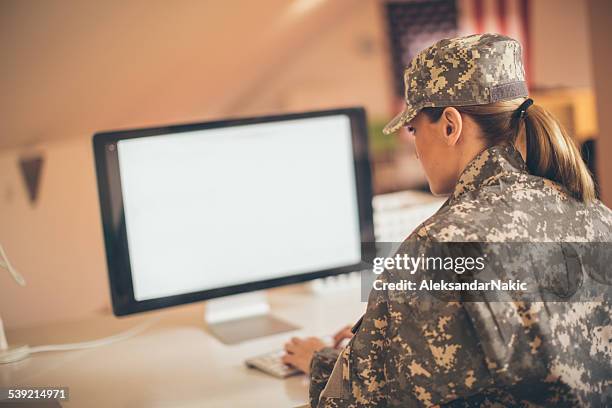 soldier using computer - military computer stock pictures, royalty-free photos & images