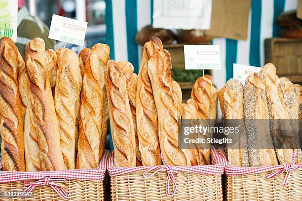 baguettes im the market - french baguette stock-fotos und bilder