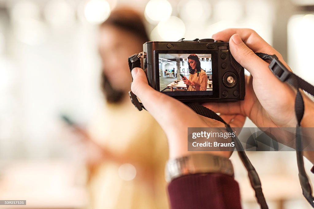 Taking a photo with digital camera.