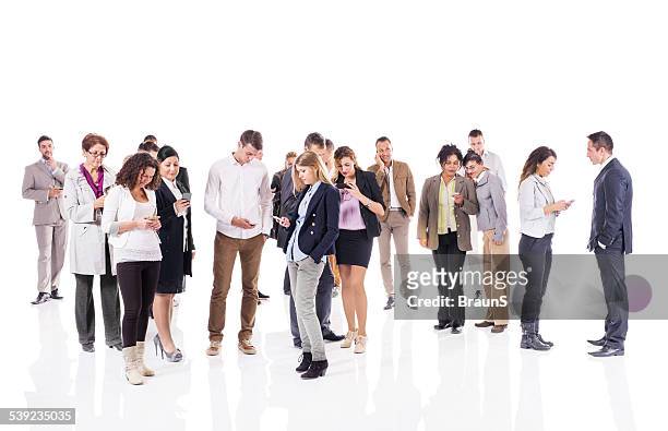 large group of business people text messaging on smart phones. - large group of people white background stock pictures, royalty-free photos & images