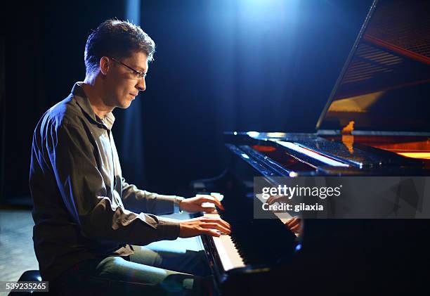 piano player. - plucking an instrument stock pictures, royalty-free photos & images