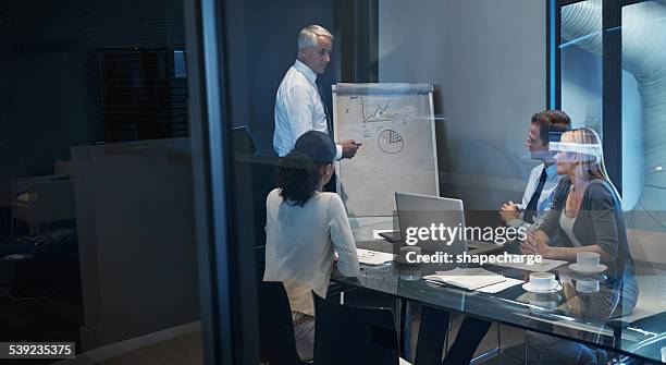 showing them his business model - business model stock pictures, royalty-free photos & images