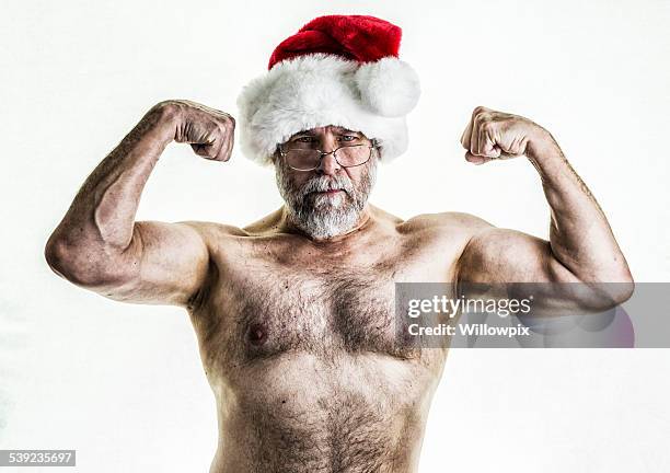 santa claus flexionar los músculos - hairy chest fotografías e imágenes de stock