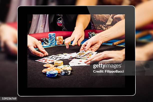 online gambling on tablet - internet gambling stock pictures, royalty-free photos & images