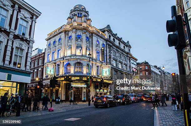 an evening on shaftesbury avenue in soho london - westend stock pictures, royalty-free photos & images
