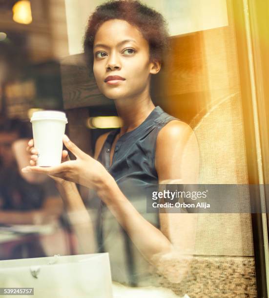 woman having coffee in new york city - soho new york stock pictures, royalty-free photos & images
