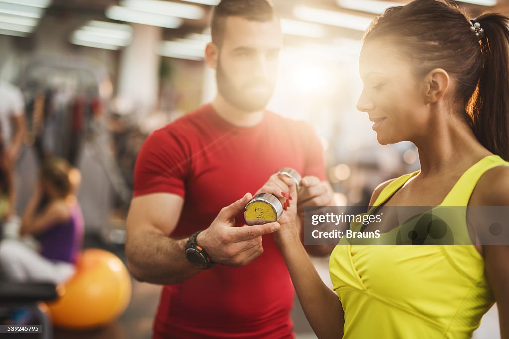 Workout with personal trainer in a gym.