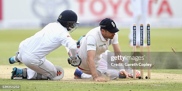 Kusal Mendis of Sri Lanka crashes into James Anderson of England as he makes his ground during day two of the 3rd Investec Test match between England...