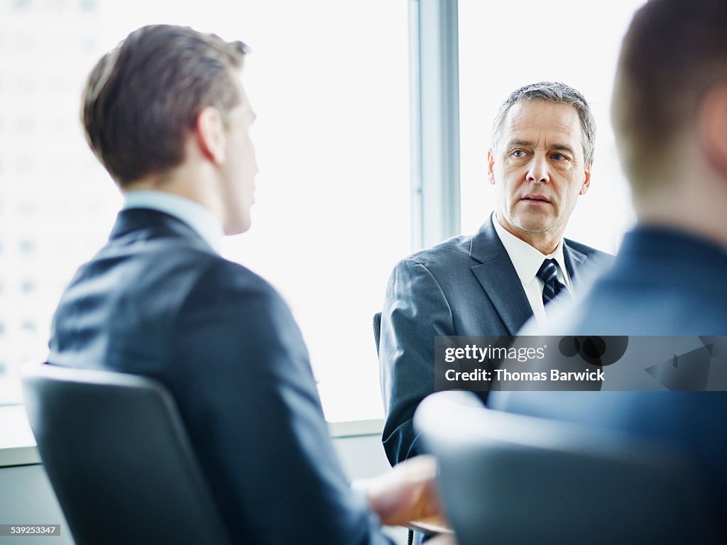 Business executives in discussion during meeting