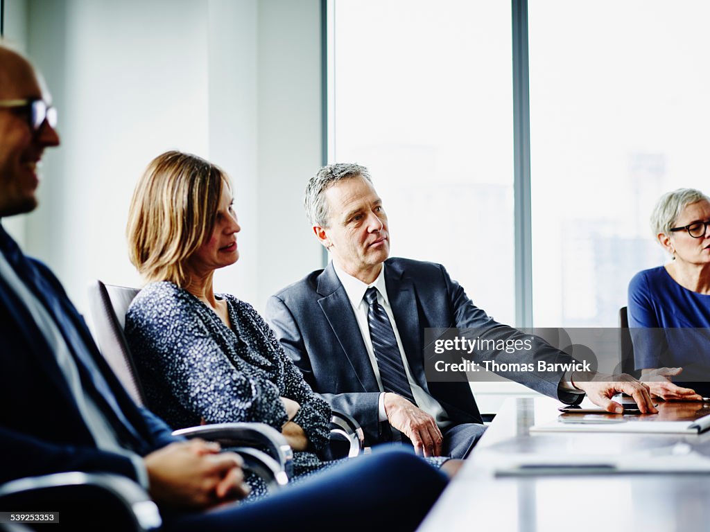 Group of business executives in meeting in office