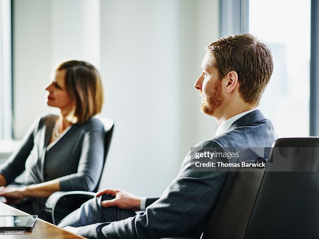 Businessman listening during office meeting