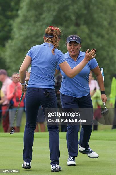 Hannah O'Sullivan of the United States celebrates her birdie on the 18th hole with her partner Mariel Galdiano during the Afternoon Fourballs match...