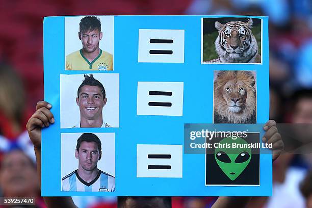 Fan holds up a banner comparing Neymar, Cristiano Ronaldo and Lionel Messi during the Copa America Centenario Group D match between Argentina and...