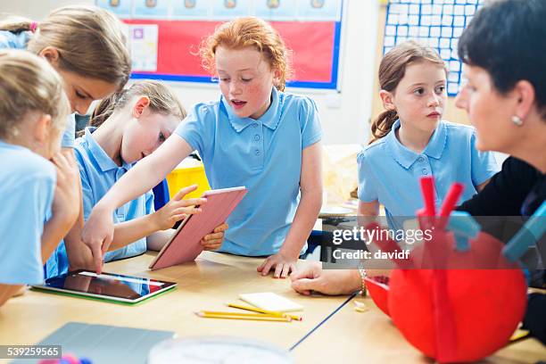 school children studying with tablet computers - school students science stock pictures, royalty-free photos & images