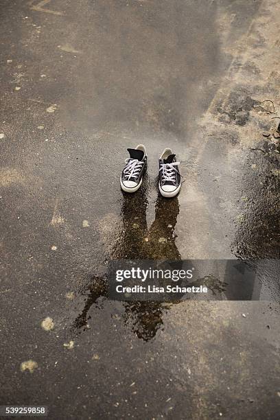 ghost with shoes on - paradox stock pictures, royalty-free photos & images