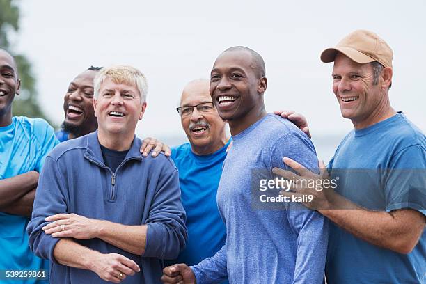vielfältige gruppe von männern stehen zusammen - african american man wearing shirt stock-fotos und bilder