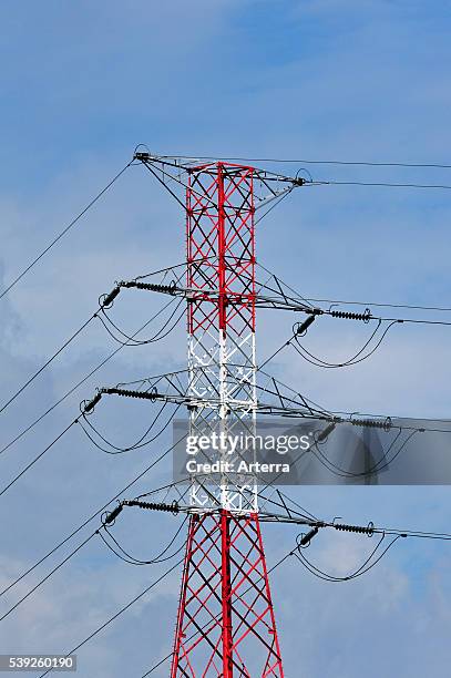 High voltage pylon / transmission tower / electricity pylon in red and white.