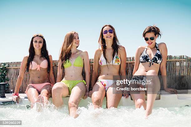 girls having fun in hot tub - girls in hot tub stockfoto's en -beelden