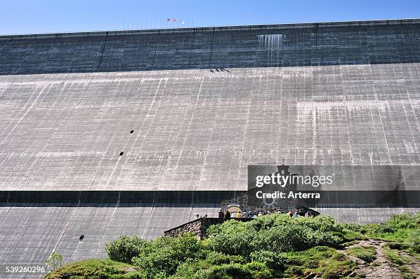 Chapel in front of the Barrage de la Grande Dixence / Grande Dixence Dam in Switzerland, the highest dam in Europe. It holds back the lake Lac des...