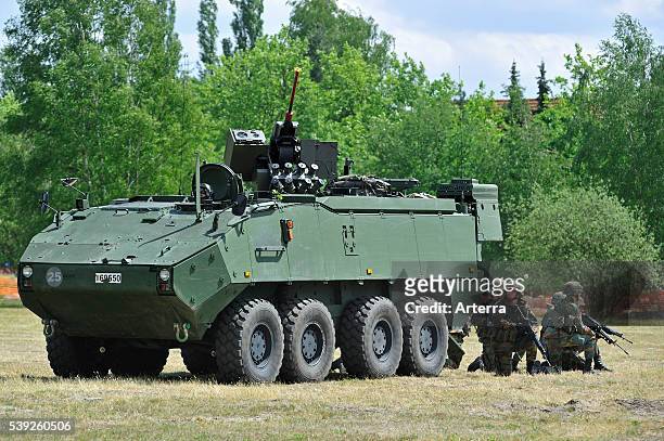 Demonstration of infantry soldiers fighting near MOWAG Piranha IIIC armoured fighting vehicle during open day of the Belgian army at Leopoldsburg,...