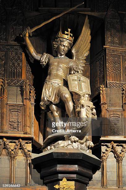 Statue of Archangel Michael slaying a dragon at Mont Saint-Michel, Normandy, France.